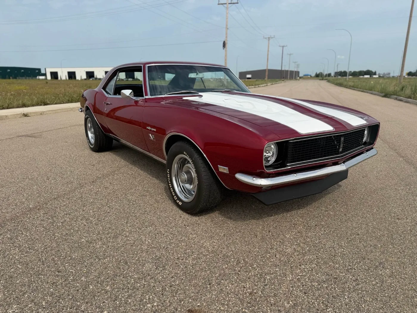 Restored 1968 Chevrolet Camaro RS in maroon with white stripes